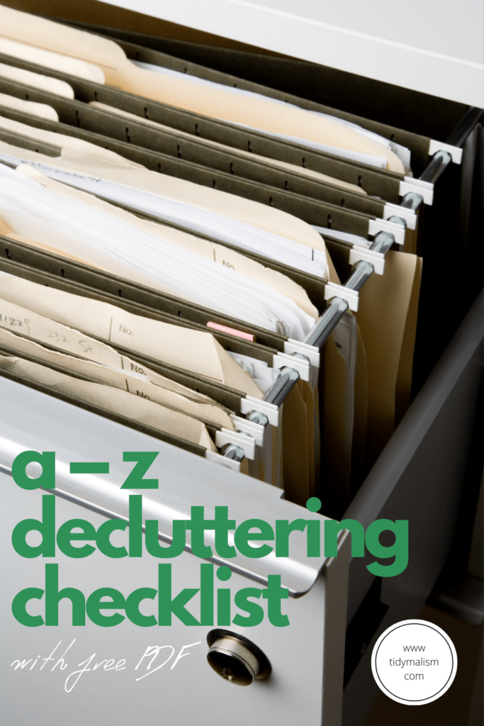 File cabinet full of hanging file folders. Caption reads A-Z Decluttering Checklist with Free PDF, tidymalism.com