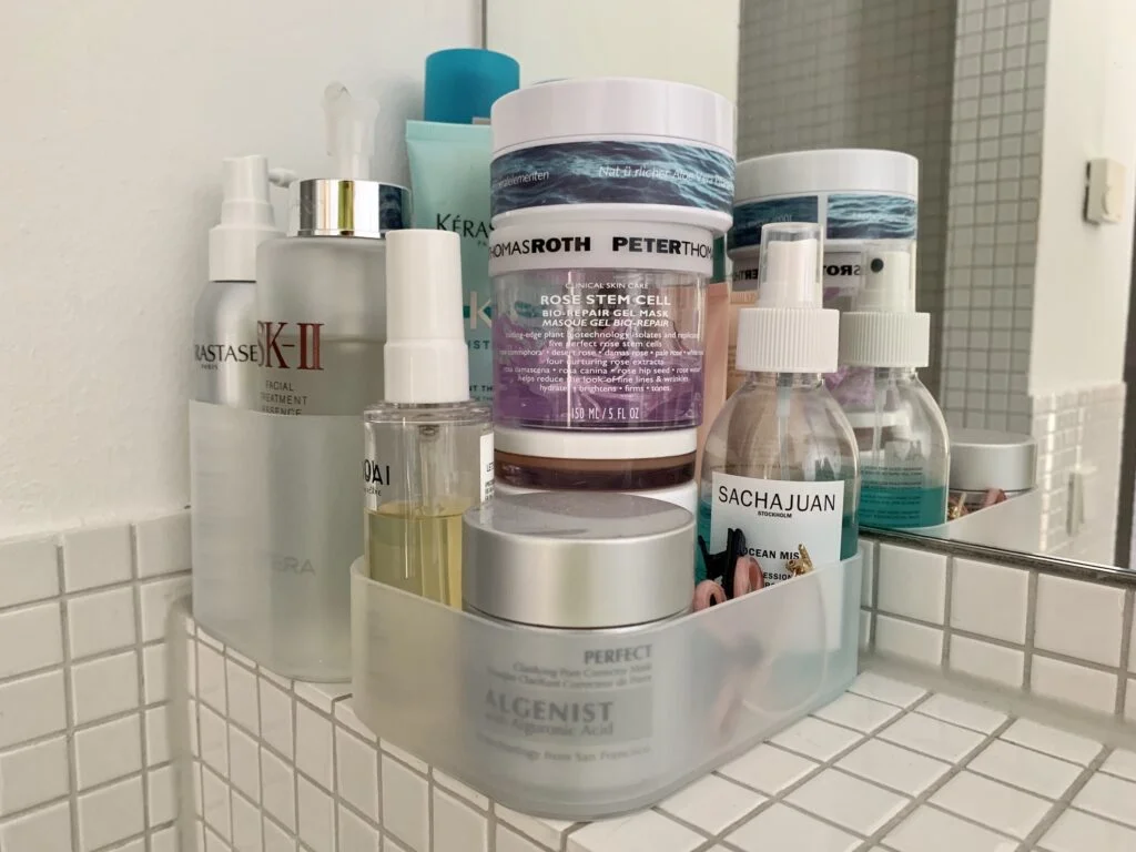 Photo of PP polymer organising trays and containers from Muji used in the bathroom to organise facial creams and hair products.