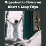 Photograph of a woman in a hotel room, opening up the curtains and looking out the window as she stretches her arms. Caption reads 7 best tips for staying organized in hotels on short and long trips.