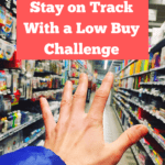 An empty supermarket aisle with colourful office and school supplies. An outstretched hand is reaching into the aisle from the left-hand corner of the photograph, as if in longing to go shopping. Caption reads: how to easily stay on track with a low buy challenge.