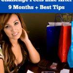 Woman in her late twenties sitting at her desk reviewing some receipts and balancing her finances or checkbook. There are a few shopping bags to one side of her desk. She's looking up at the camera and smiling. Caption reads: what a low buy challenge feels like after nine months, plus best tips.