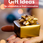 Outstretched white hand holding a small gift wrapped in gold paper with a gold bow. Holiday lights in background of image. Caption reads: Clutter-free gift ideas for minimalists and from minimalists.