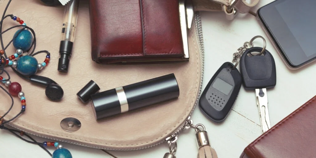 Photograph of the contents of a woman's handbag, one of the most overlooked areas to declutter.
