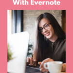 Young lady with long, brown hair and glasses sitting at her laptop working on something. There is a cup of coffee to her left and she's smiling at what she sees on her screen. Caption reads: Digital minimalism. Organizing content with Evernote.