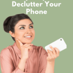 Young lady with brunette hair tied up in a bun, wearing a peach colored long sleeve blouse and holding a white smartphone. Caption reads "6 easy steps to declutter your phone"