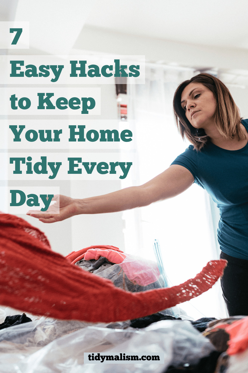White woman late thirties, early forties tossing a red blanket onto her bed as she declutters and tidies up. Caption reads: 7 easy hacks to keep your home tidy every day.