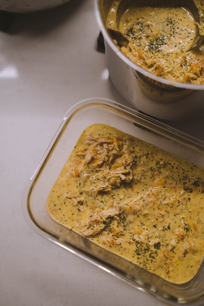 Close-up of a big batch of stew or casserole in a yellow-ish colour. Meal prepping and cooking ahead are are some great tips to save time throughout the week.