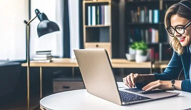 Computer-generated 3D render of a young woman with glasses and earphones sitting in a study, working at her laptop with a smile on her face.