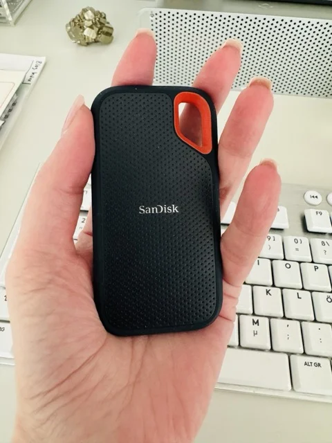 SanDisk extreme portable SSD in the palm of a hand