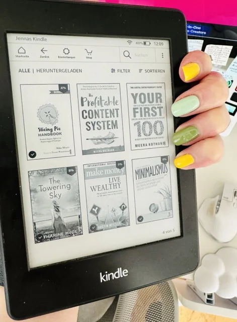 photograph of hand holding a Kindle